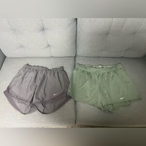 3 Pairs of athletic shorts. 2 Nike and 1 Underamour.